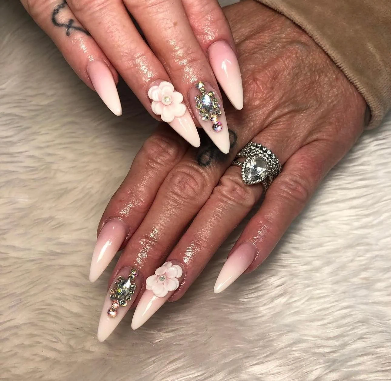 Soft pink ombré stiletto nails with diamantés and 3D flowers by Nailed by Ellie